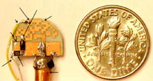 Dimensions of optimized antenna in comparison with a 10-cent coin