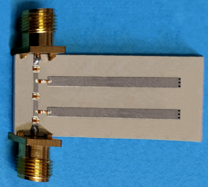 Second-order microstrip LD BPF with mixed couplings and 7 AP